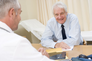 Man in doctor's office smiling